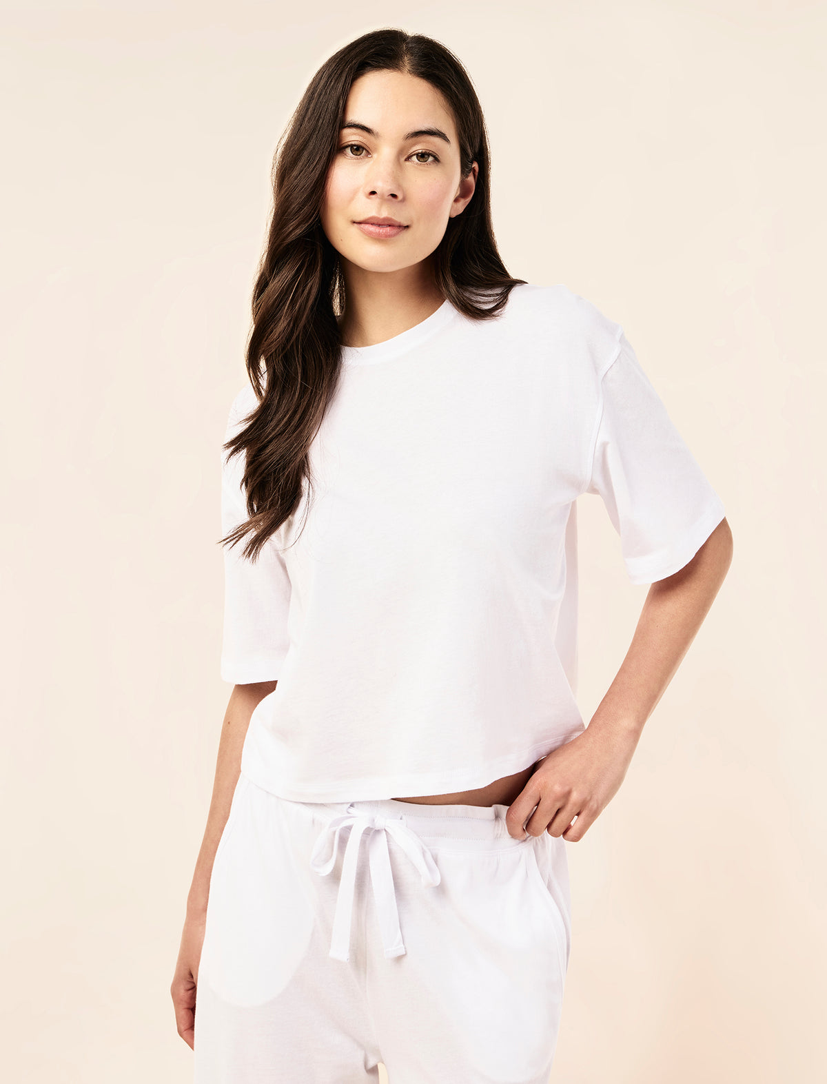 Sakura wearing the Jada Organic Cotton Knit Crop Tee
[model: Sakura wears size S |  Height: 173cm/ 5’8” | Bust: 81cm | Waist: 64cm | Hips: 89cm]