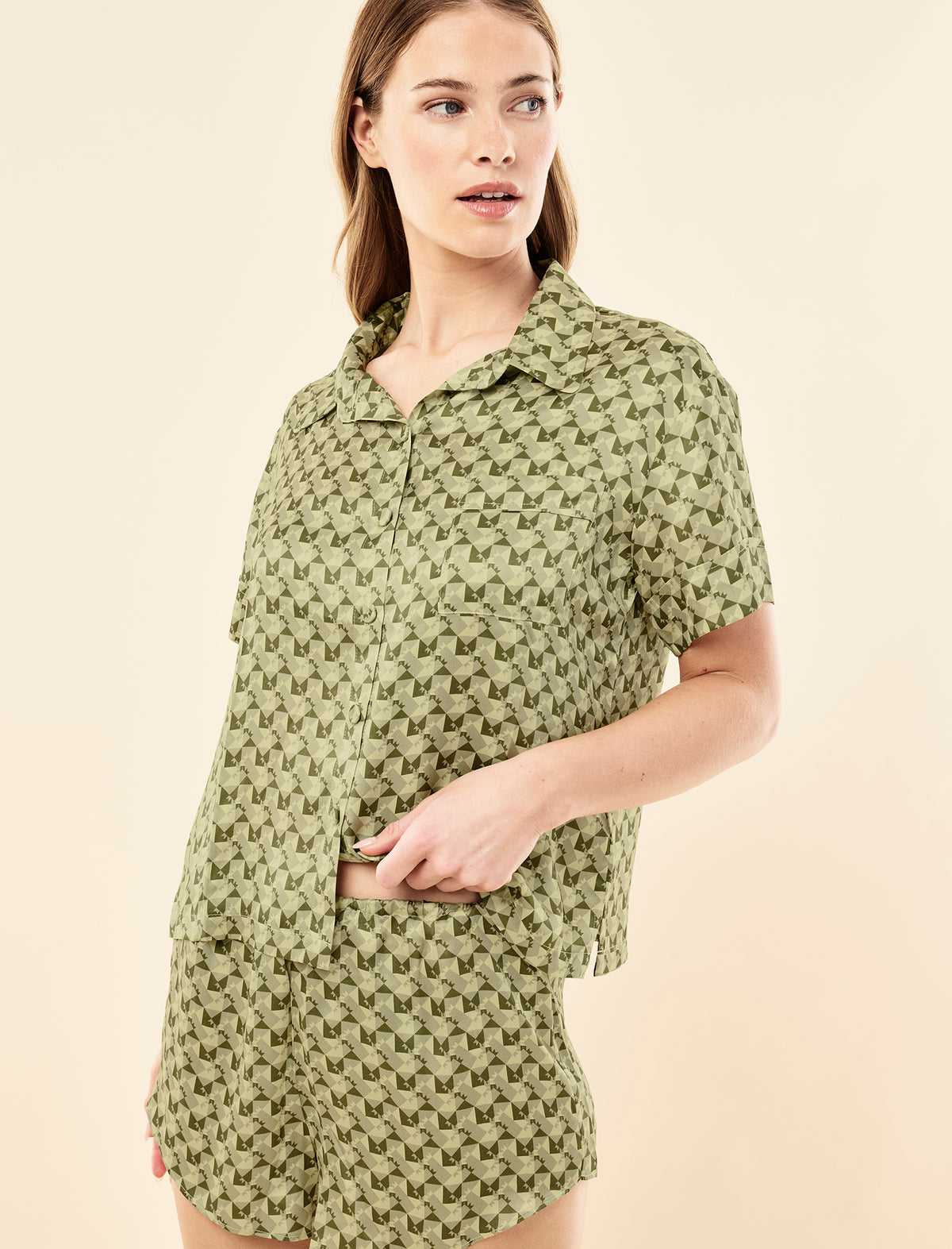 Sianie wearing the Karen Walker Monogram Tiles Silk Boxer PJ Set
[model: Sianie wears size S |  Height: 175m
/ 5’9” | Bust: 85cm | Waist: 66cm| Hips: 93cm]